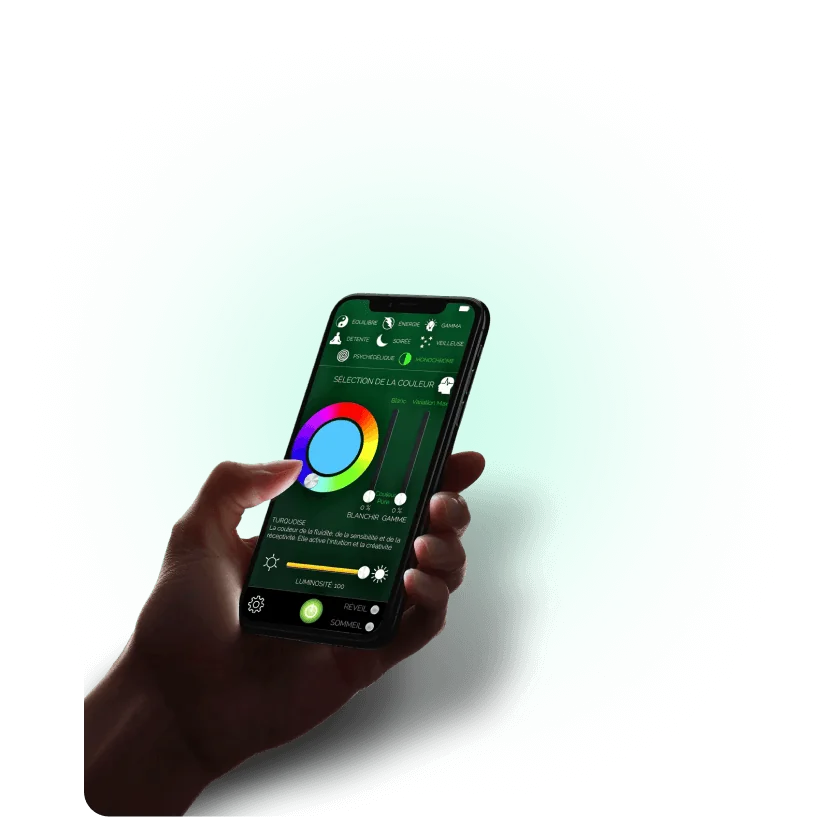 A hand holding a phone with the Senso App colour wheel